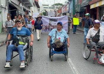 protesta silla de ruedas alza pasaje